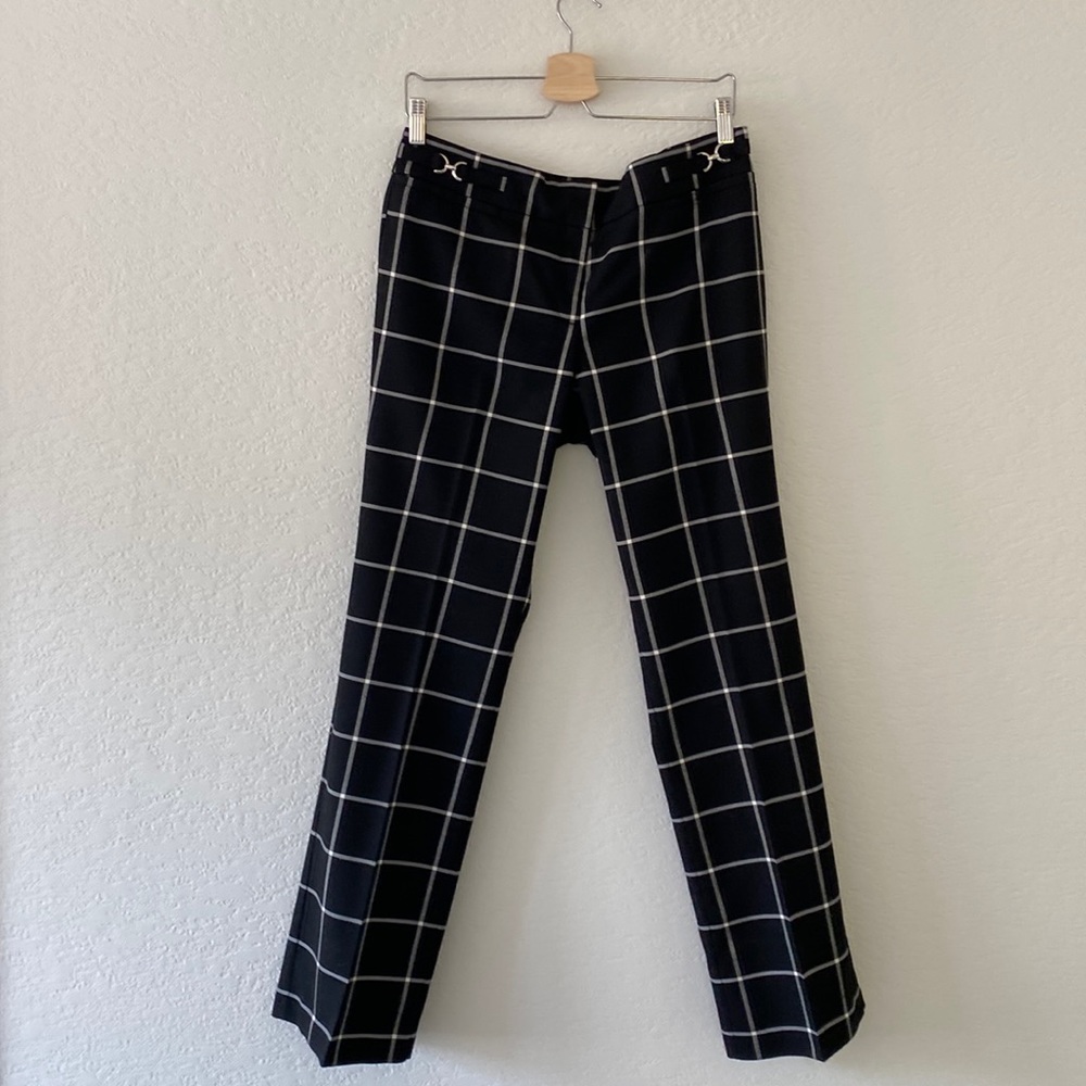 Black and bone trousers with silver accents.
